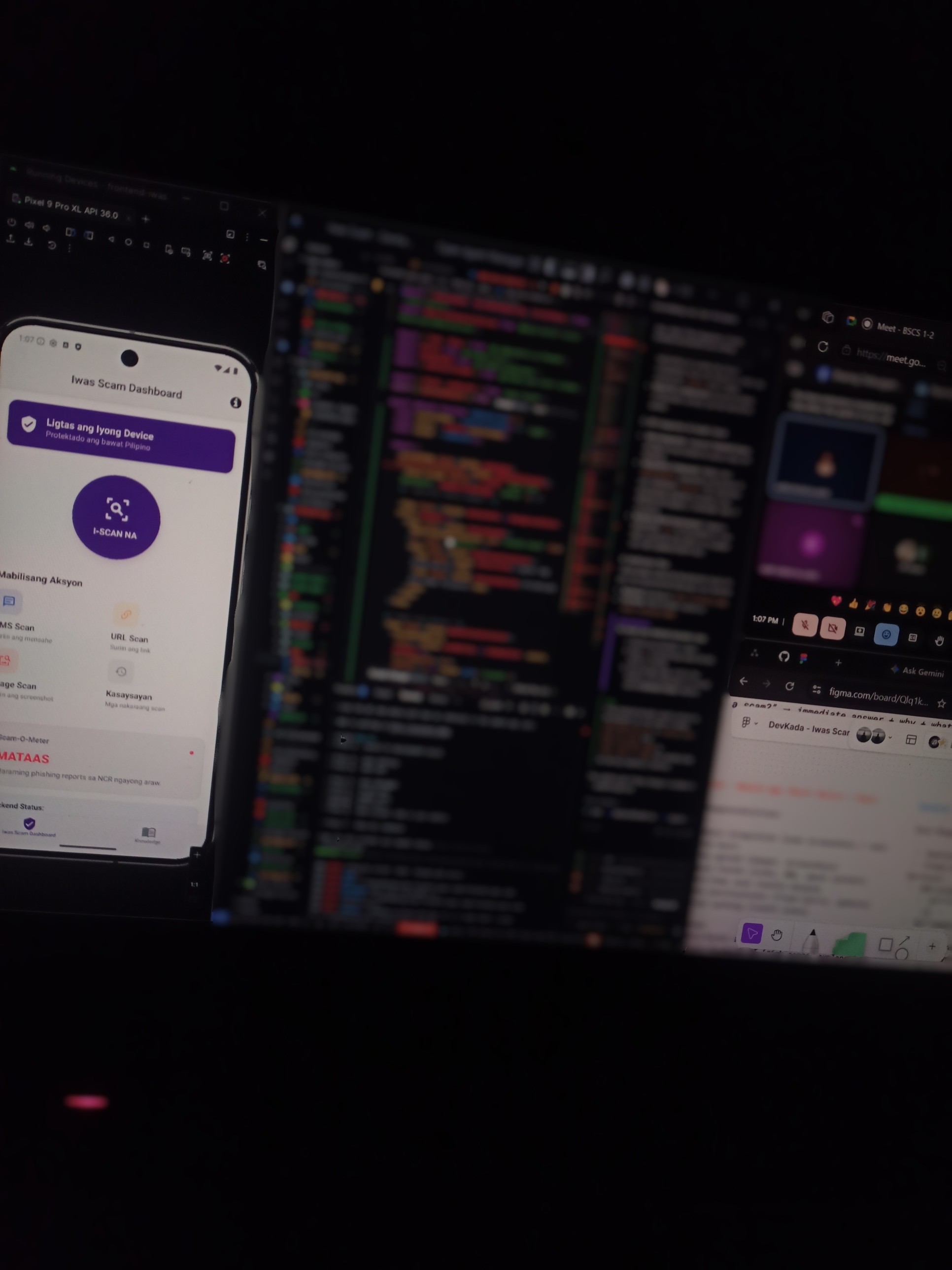 The grind — emulator running Iwas Scam dashboard, code editor in the background, Figma and class on the side