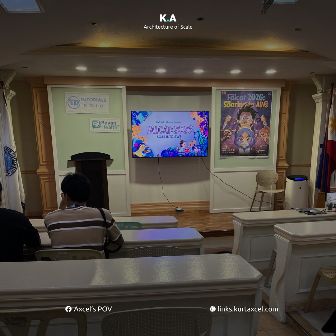 Hall before it fills, with a screen reading FALCAT 2026 / SOAR INTO AWS and AWS SBG - Adamson University